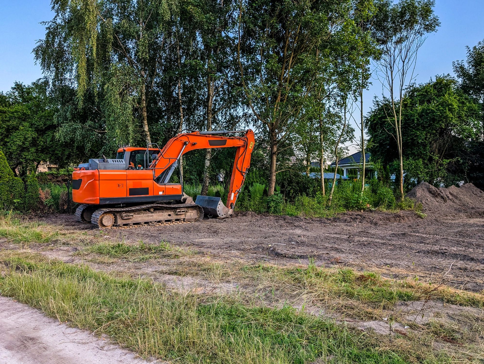Excavator working on pond construction and earthmoving